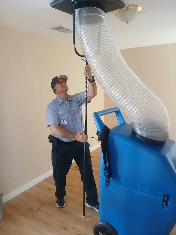 Furnace Tune-Up technician using HEPA equipment in Maryland Heights